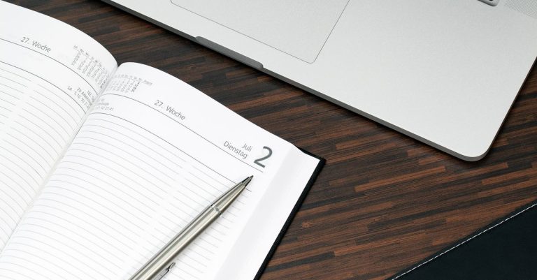 Spreadsheet versus tutor workspace: a printed spreadsheet with handwritten notes beside a tidy lesson planner.